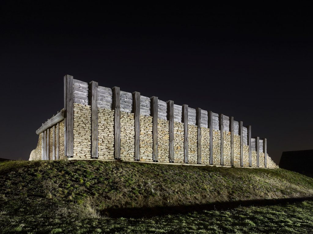 Reconstructed Celtic post slot wall with ditch, a defensive wall, at the foot of Mount Ipf.