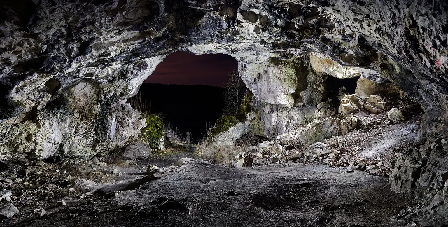 The illuminated interior of the Bockstein Cave in Lonetal valley