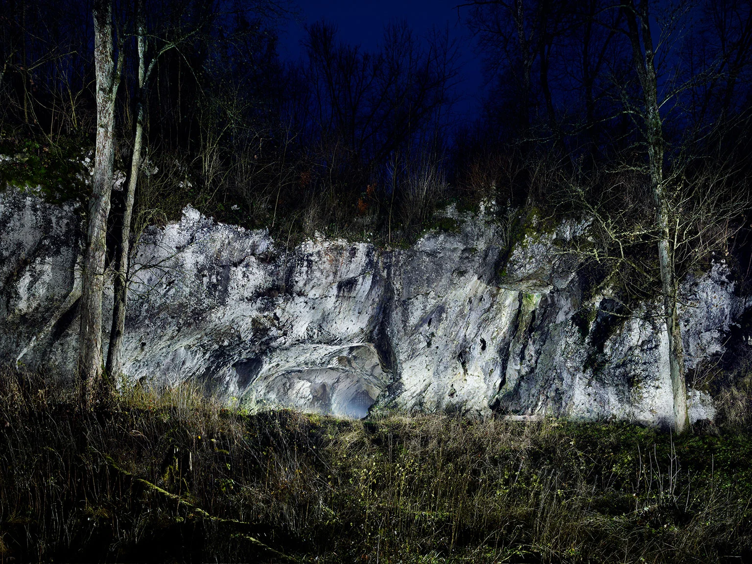 The illuminated entrance to the Hohlenstein-Stadel Cave in Lonetal