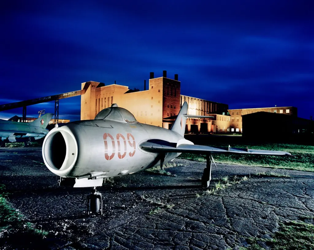 Russian MiG-17 fighter jet in front of the former power station at the Peenemünde Army Research Centre