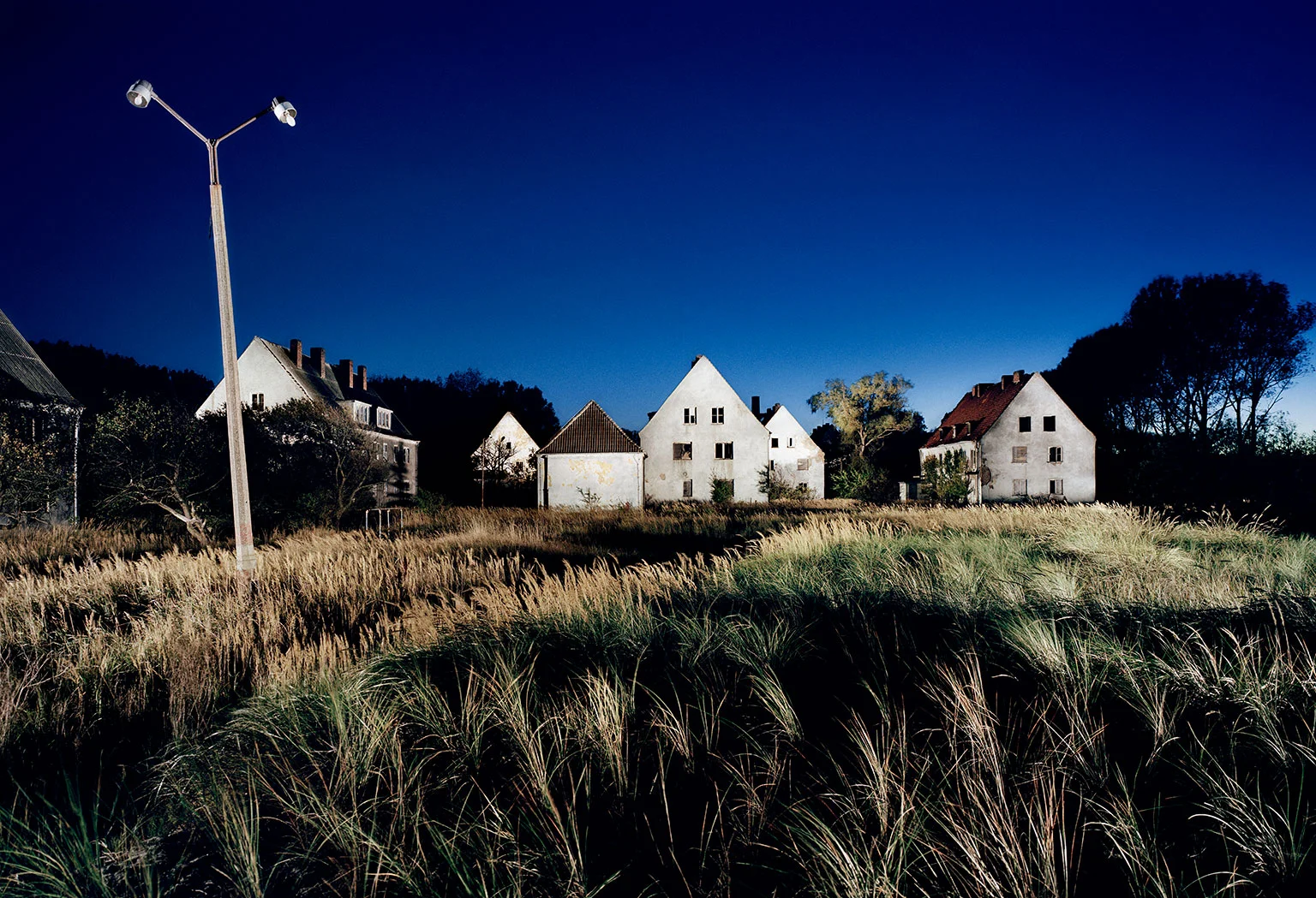 Abandoned houses on the outskirts of the garden city of Wustrow on the Wustrow Peninsula on the Baltic Sea