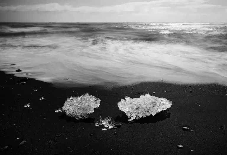 Iceland, chunks of ice on the black lava sand beach near the Jökulsárlón glacial lake